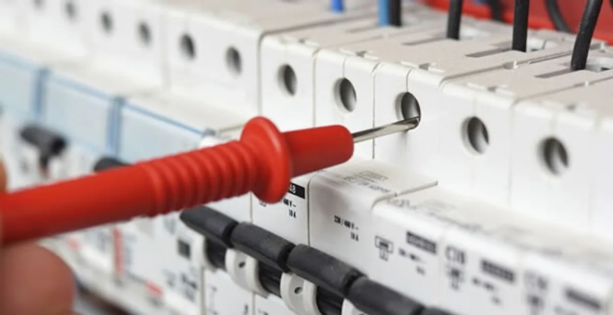 Electrical contractor testing circuit breakers during electrical repair in Sewaren, NJ