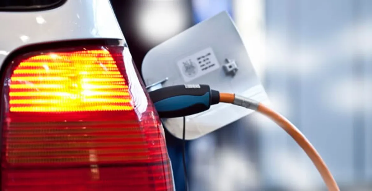 Electric car plugged into EV charger after professional installation in Staten Island, NY