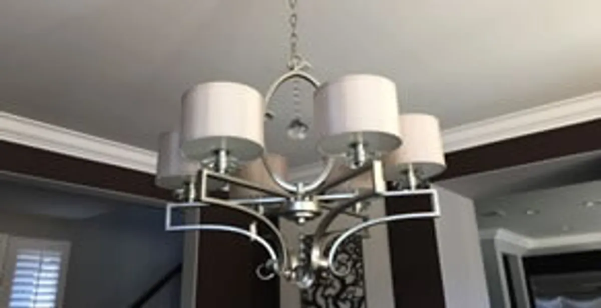 Modern chandelier installation with multiple light fixtures in Staten Island, NY