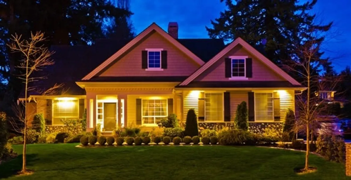 security light installation services illuminating a residential exterior at night in Staten Island, NY