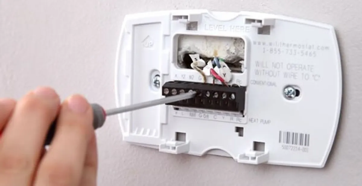 Thermostat installation service with proper wiring and secure wall mounting in Staten Island, NY